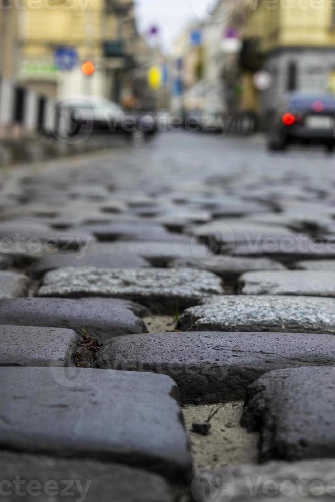 Antiga rua histórica de paralelepípedos com foco seletivo em paralelepípedos foto