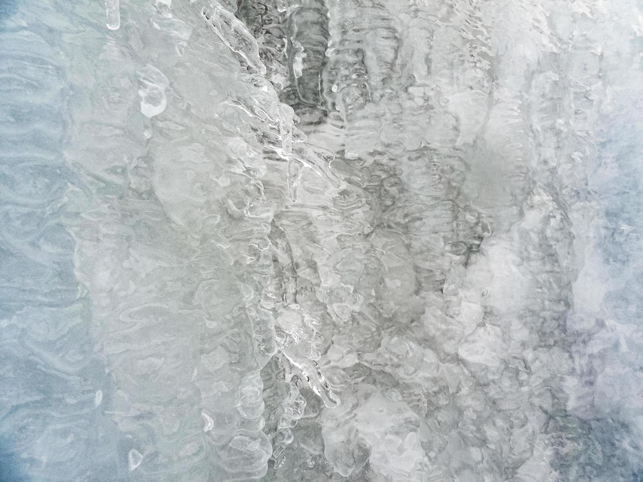 textura macro tiro de turquesa azul cachoeira congelada na Noruega. foto