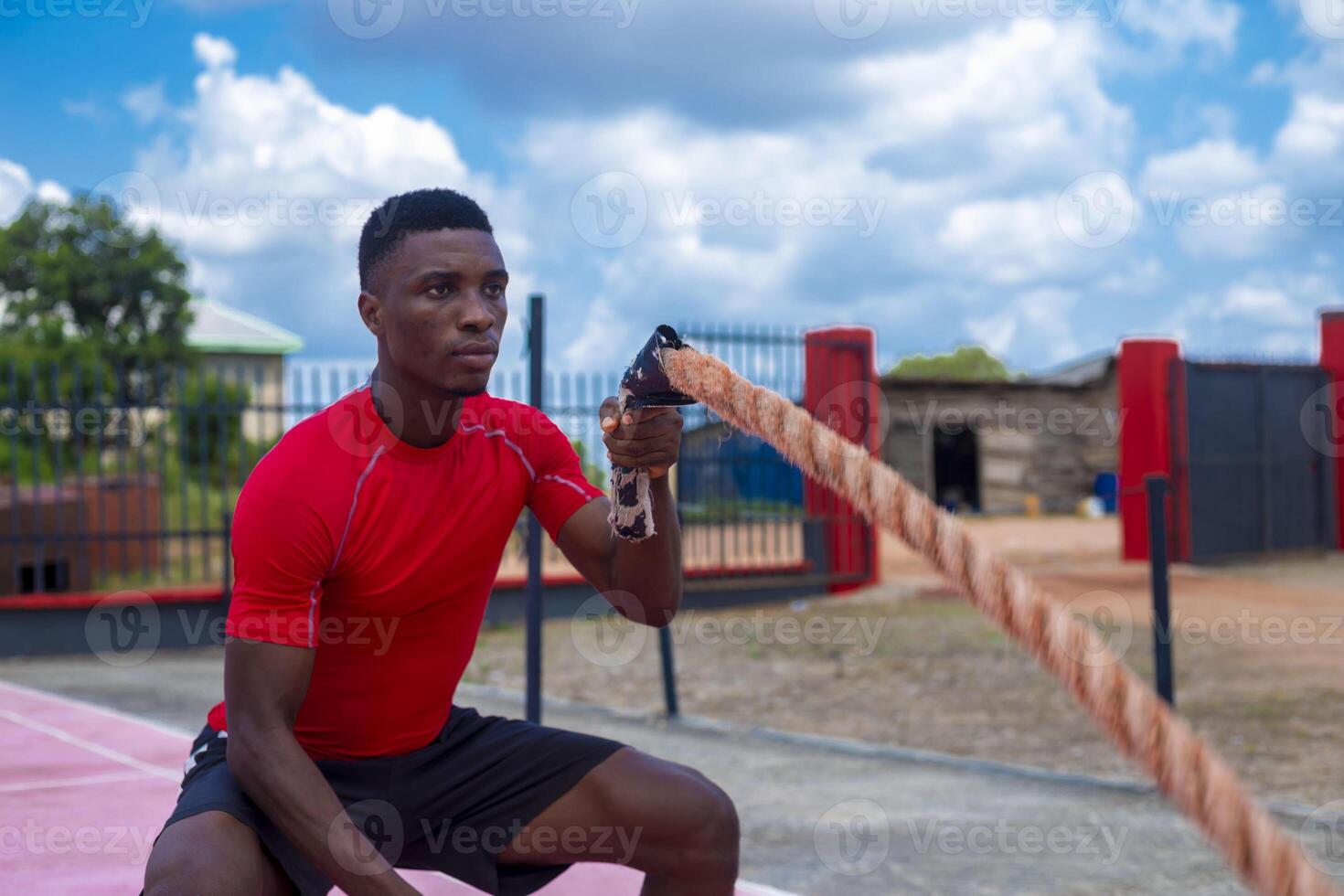 africano homem batalha corda força Treinamento foto