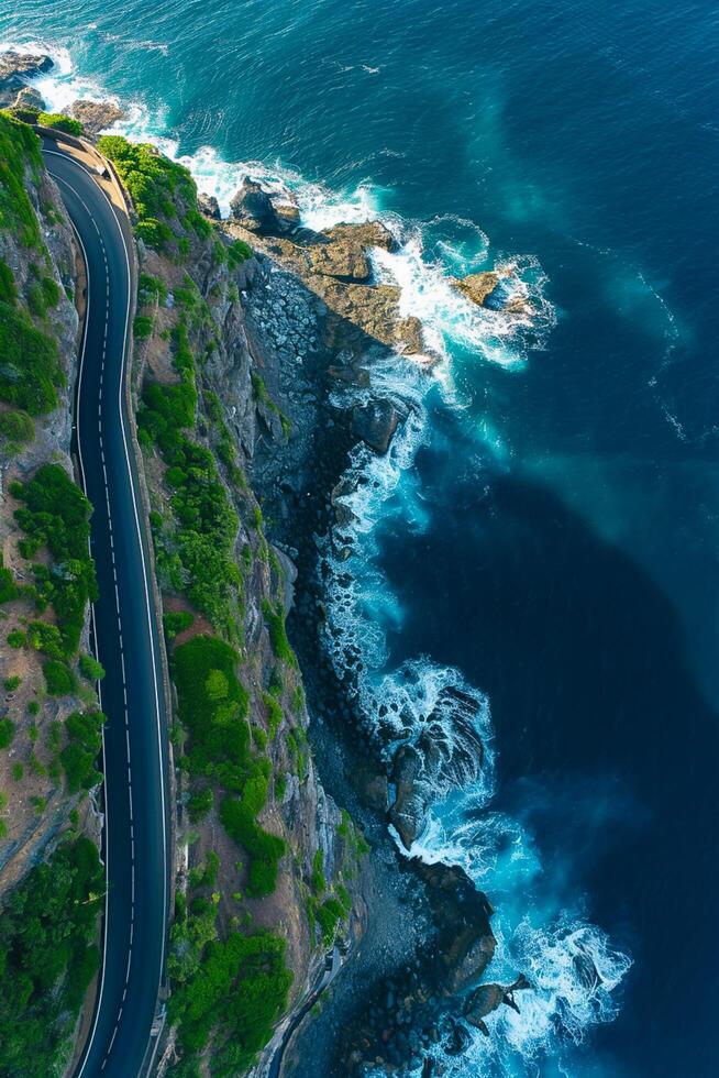 ai gerado aéreo Visão captura enrolamento estrada abraçando a litoral. a estrada é limitar e pavimentou, com visível faixa marcações ai gerado foto