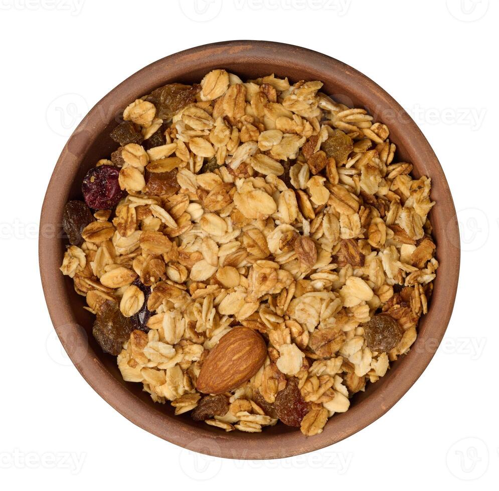 aveia, passas de uva, castanha de caju e amêndoas. granola dentro volta prato foto