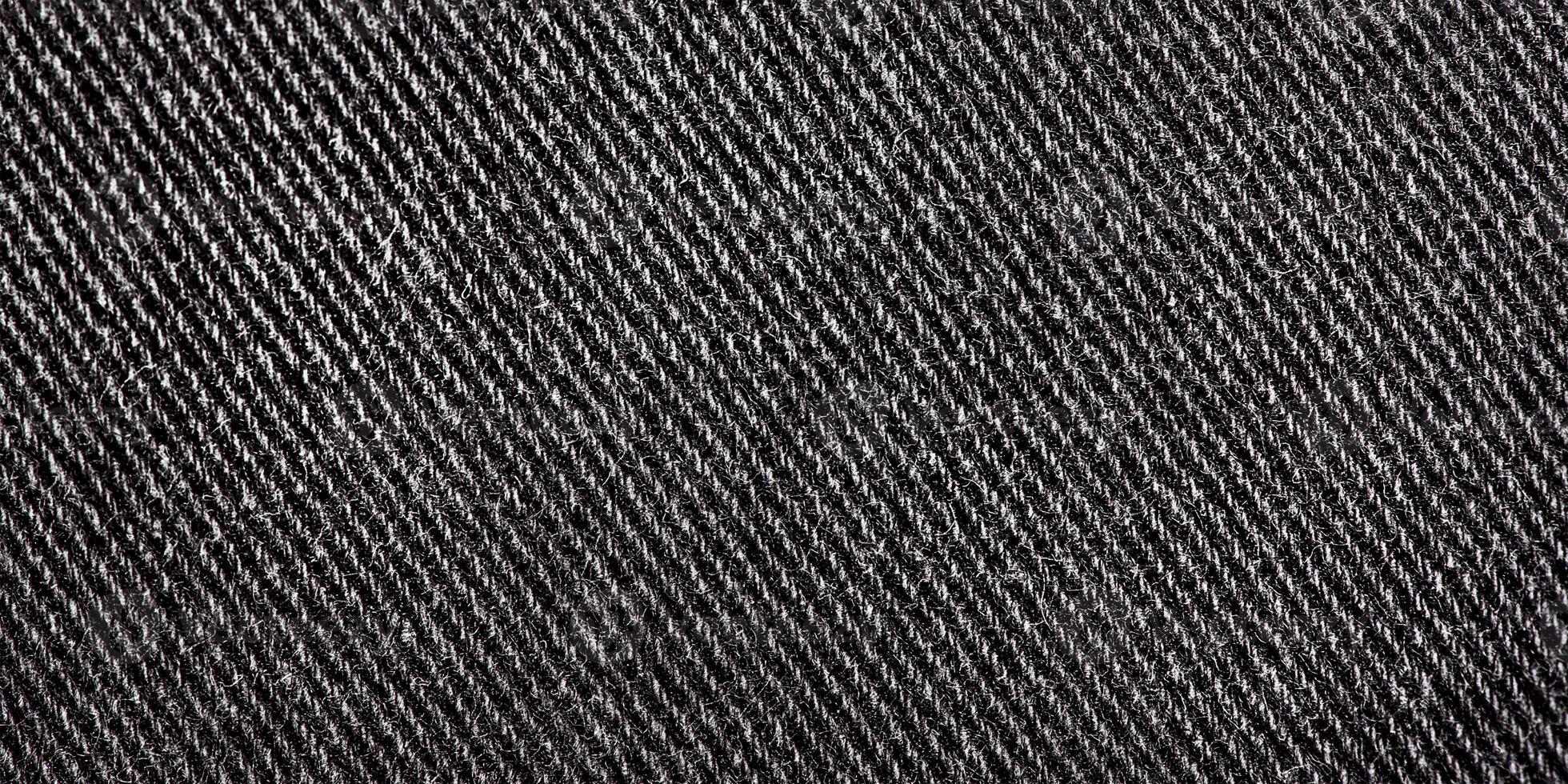 Preto jeans tecido macro foto. jeans Como uma fundo. tecido textura. foto