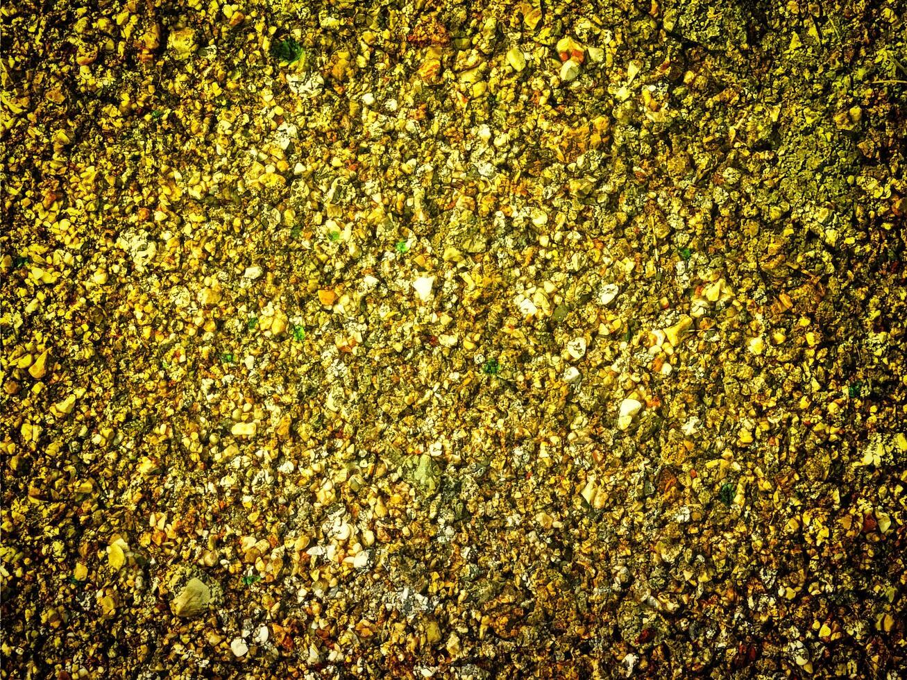 textura do amarelo pedra dentro a jardim foto