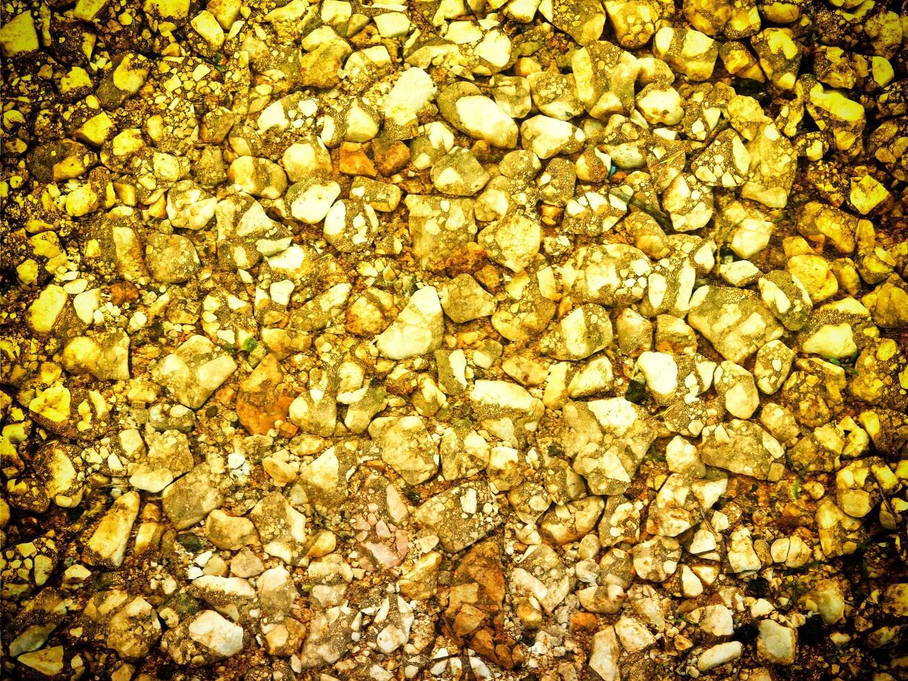 textura do amarelo pedra dentro a jardim foto