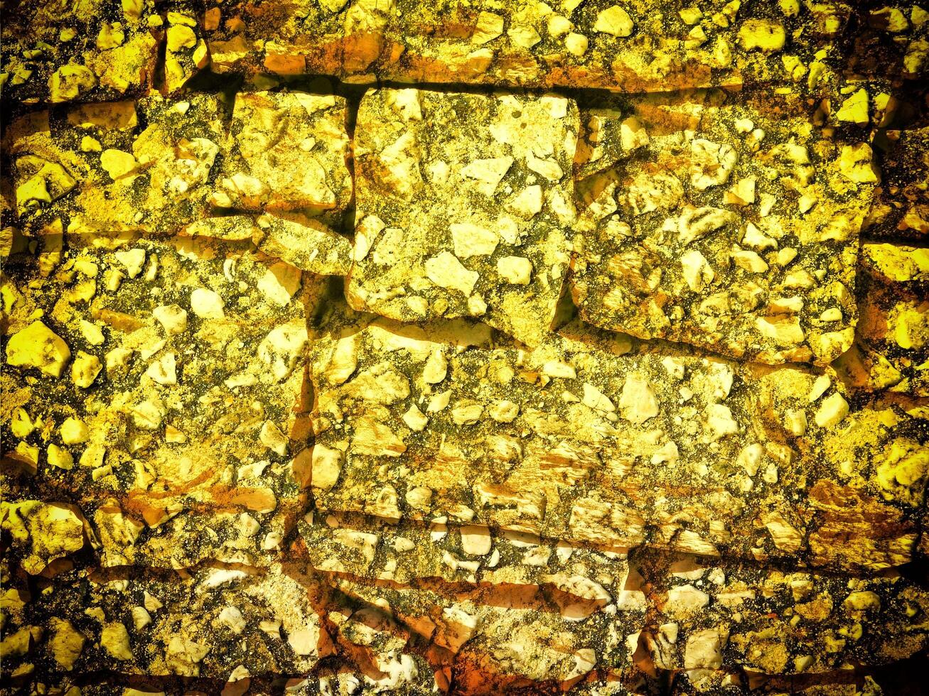 textura do amarelo pedra dentro a jardim foto