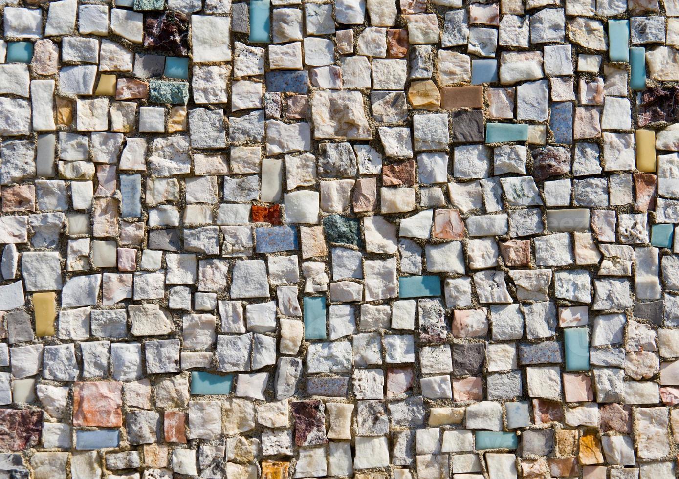 textura de mosaico de pequena parede de pedra foto