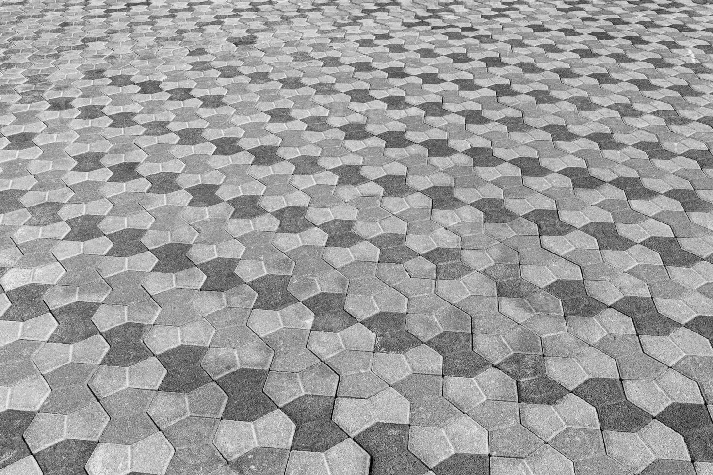 a textura do uma pedra velho calçada com uma perspectiva. Preto e branco. foto