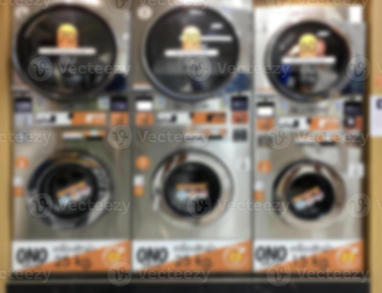 desfocado imagens do roupas secador e lavando máquina dentro lavanderia fazer compras interior para indústria, comprar, varejo, serviço foto