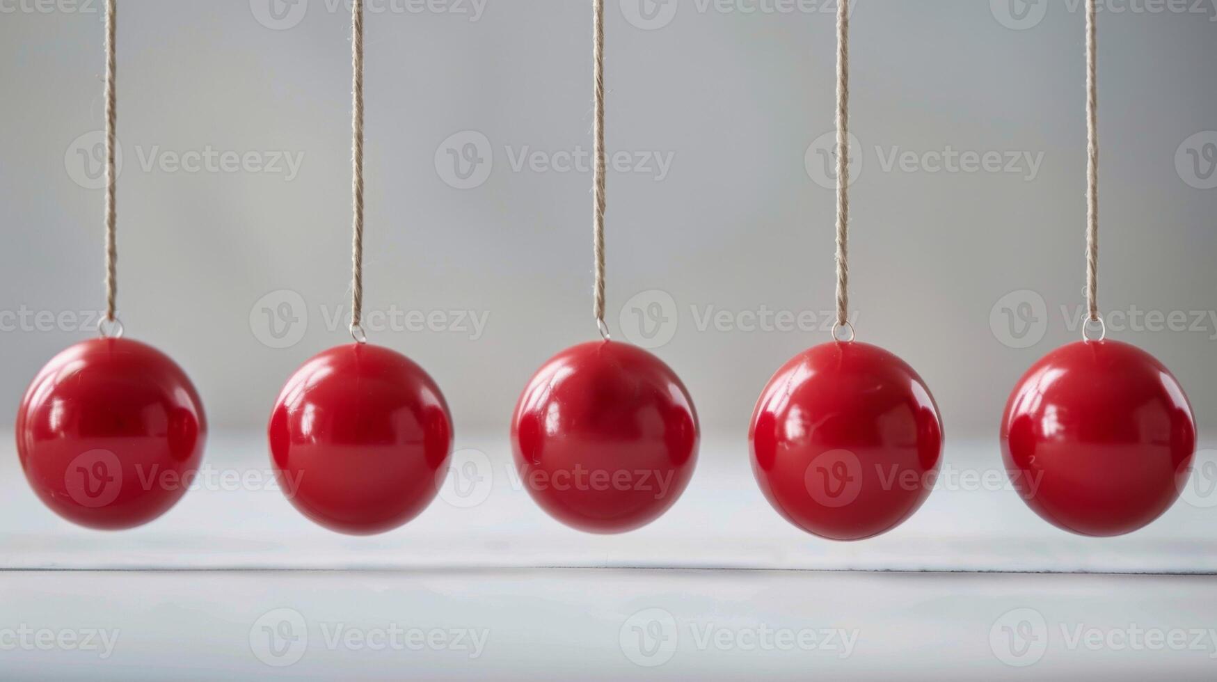 newtons berço com vermelho bolas demonstrando física conceitos do impulso, cinética energia, e conservação foto