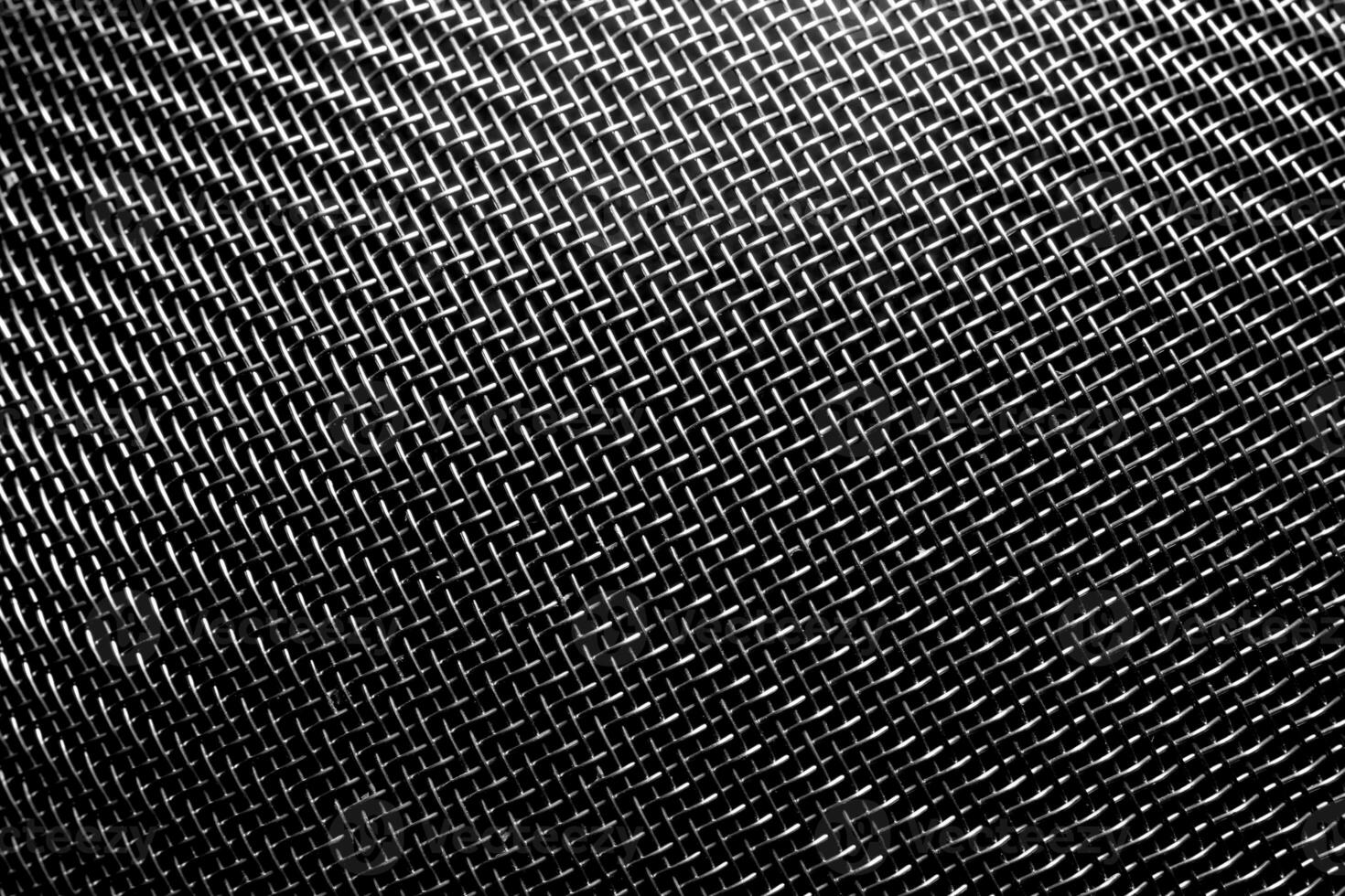 monocromático textura do uma brilhante metal escorredor de macarrão ou grato. abstrato fundo. foto