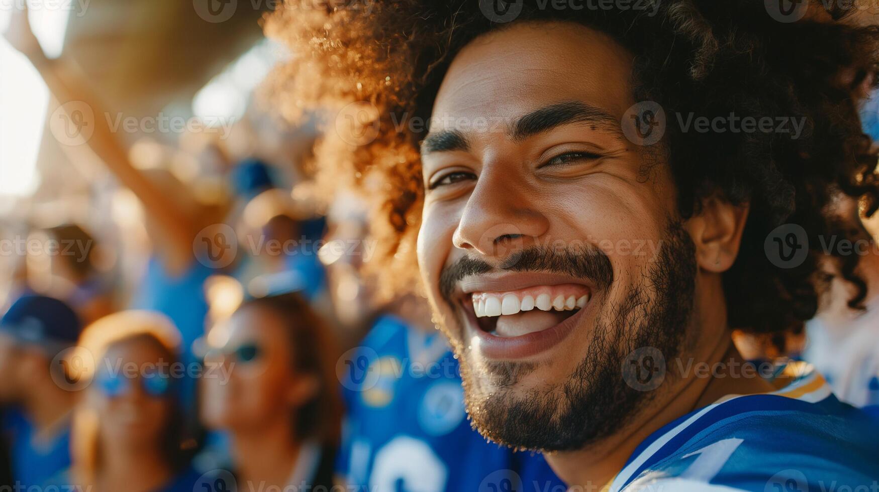 alegre africano americano masculino Esportes ventilador dentro azul jérsei a comemorar às uma estádio durante uma futebol jogo, representando excitação e trabalho em equipe relacionado conceitos, Esportes eventos, ventilador cultura foto