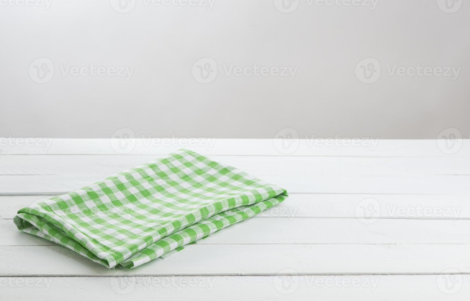 verde guardada toalha de mesa em branco mesa fundo foto