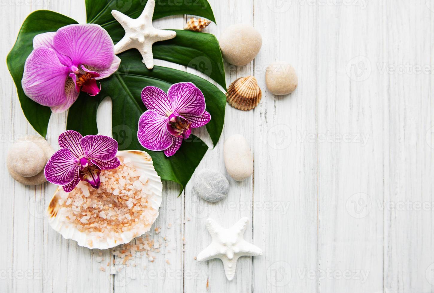 ingredientes naturais de spa com flores de orquídea foto