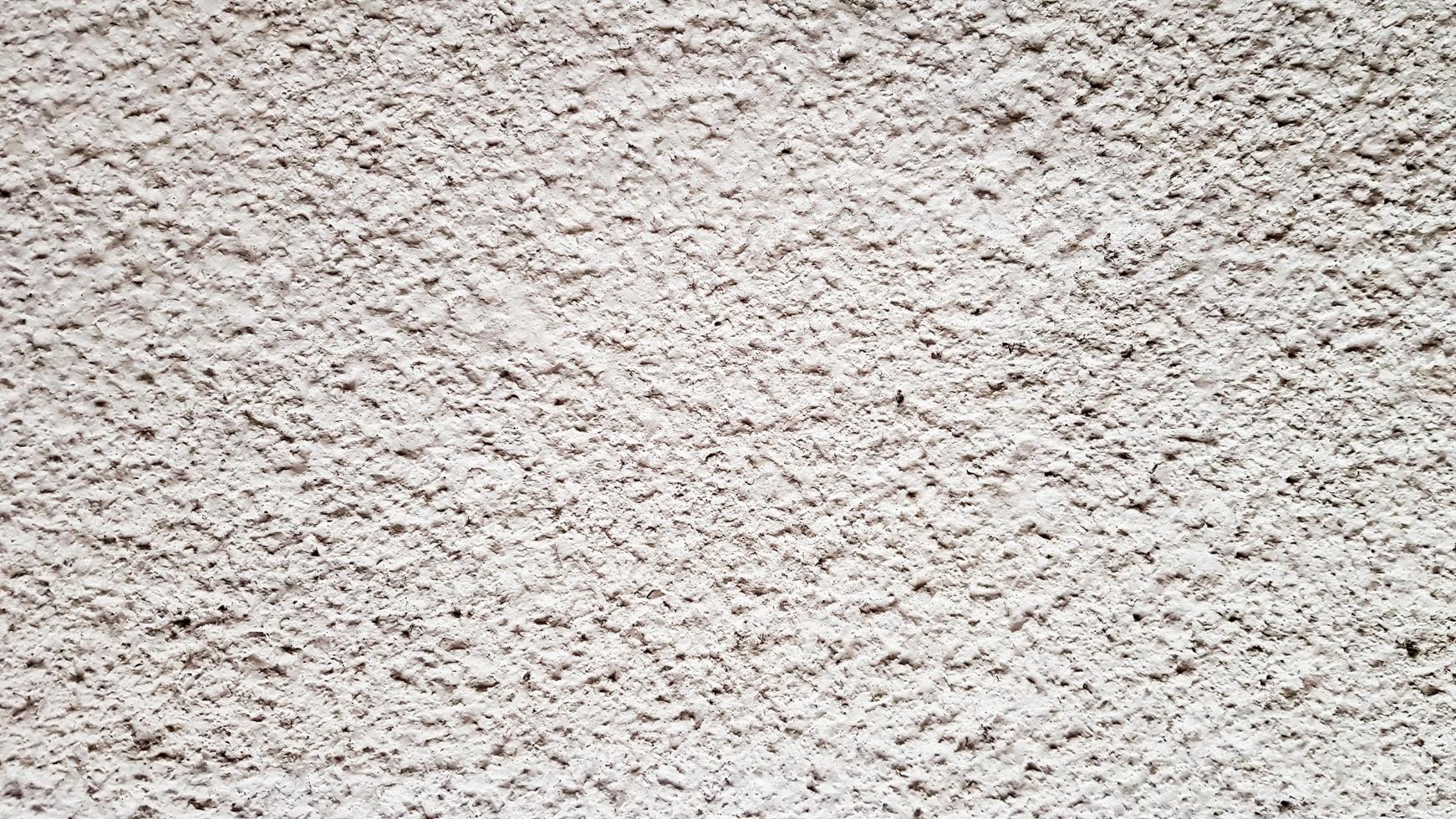 textura da parede de concreto. fundo de parede de estuque branco. parede de cimento pintada de branco. parede de concreto branco e piso como textura de fundo. loft no estilo de idéias de design de um edifício residencial. foto