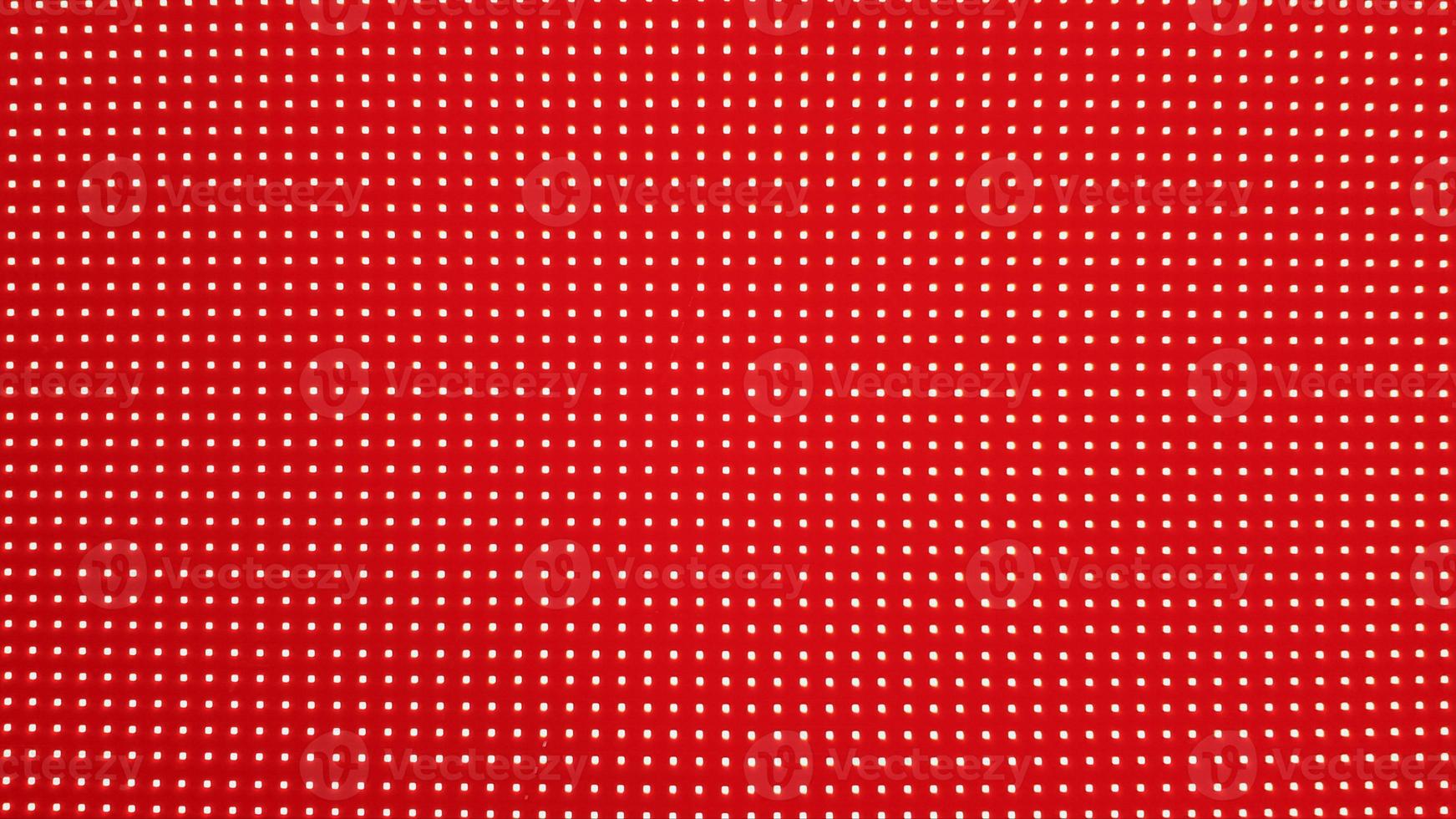textura do painel da tela led rgb. close-up de uma tela de led de pixel com bokeh para papel de parede. fundo abstrato vermelho brilhante perfeito para qualquer projeto. foto
