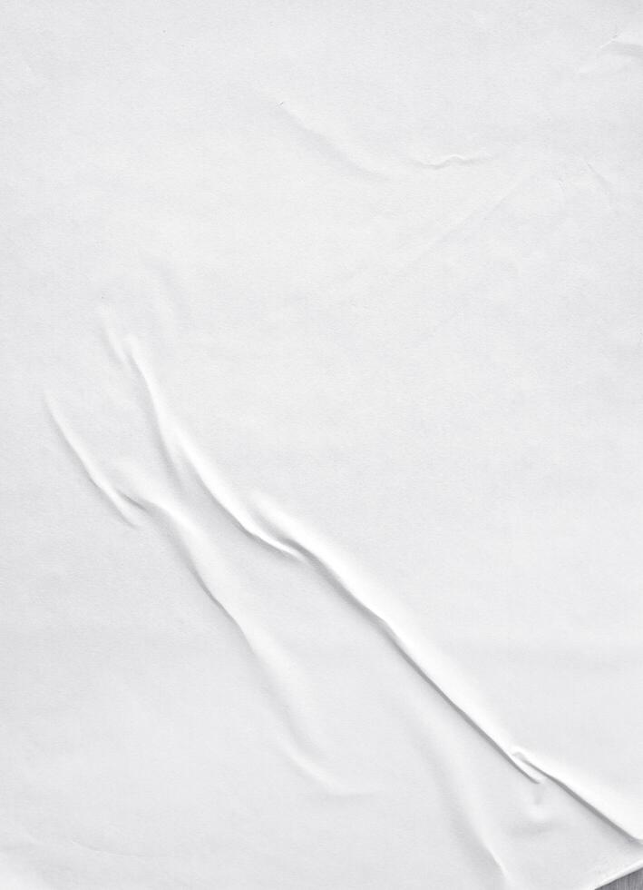 papel branco colado na parede, teksture de papel em branco para a maquete do pôster foto