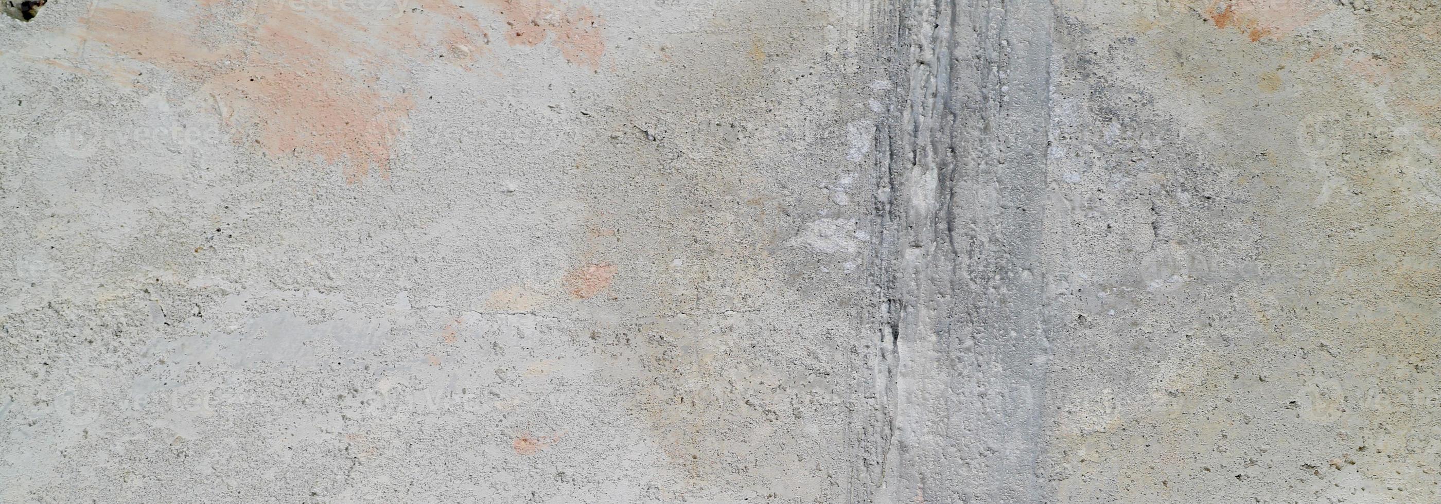 parede texturizada com cinza. textura de cimento de concreto ligeiramente cinza claro para o fundo. textura de pintura abstrata. foto