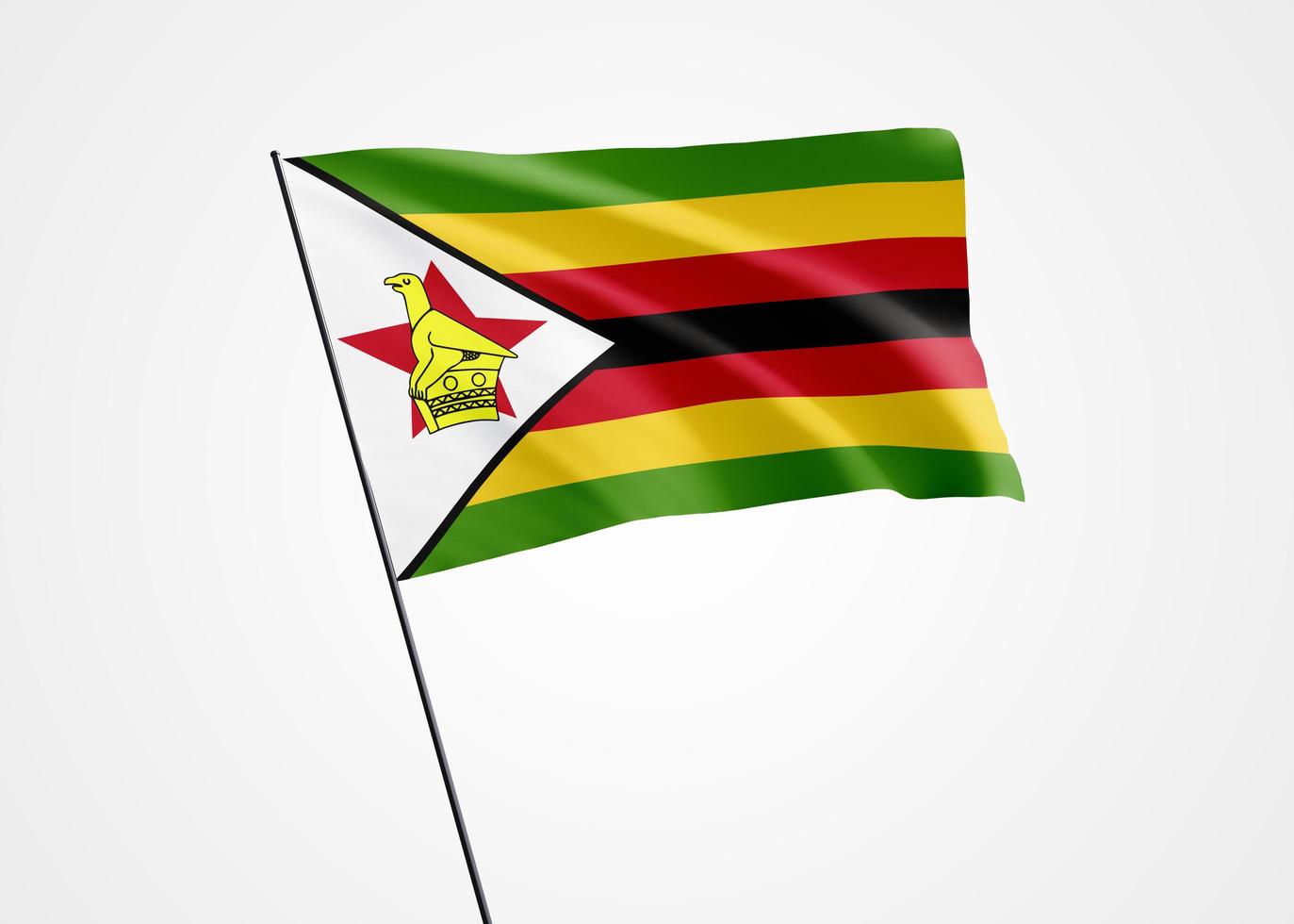 bandeira do zimbabwe voando alto no fundo branco e isolado. 18 de abril dia da independência do zimbabué. coleção da bandeira nacional do mundo coleção da bandeira nacional do mundo foto