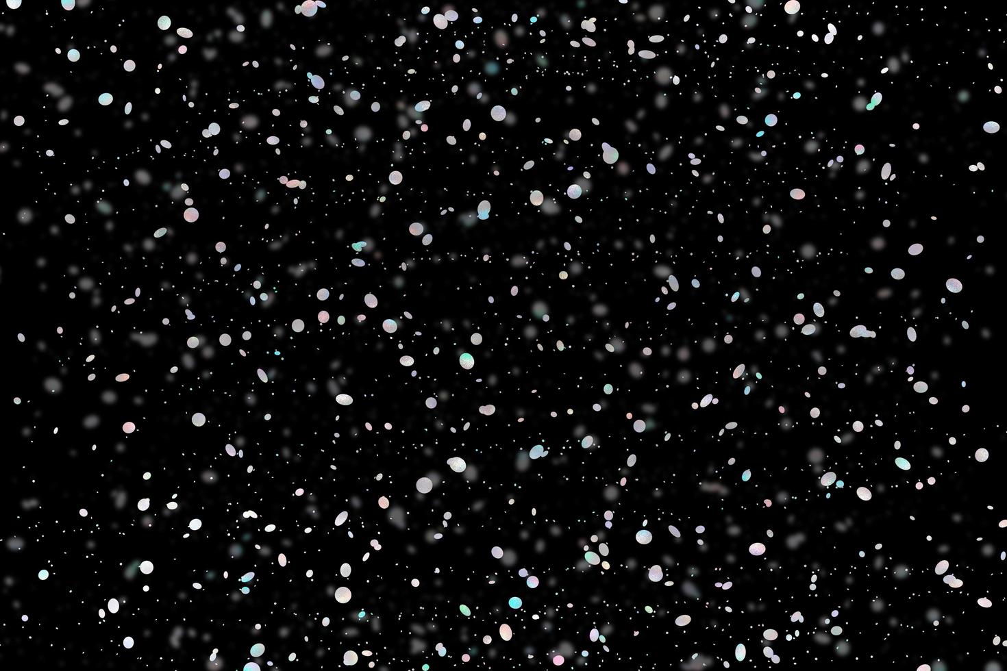 brilho colorido efeito de luz elegante abstrato em um fundo preto e cintilantes partículas de poeira mágicas em preto foto