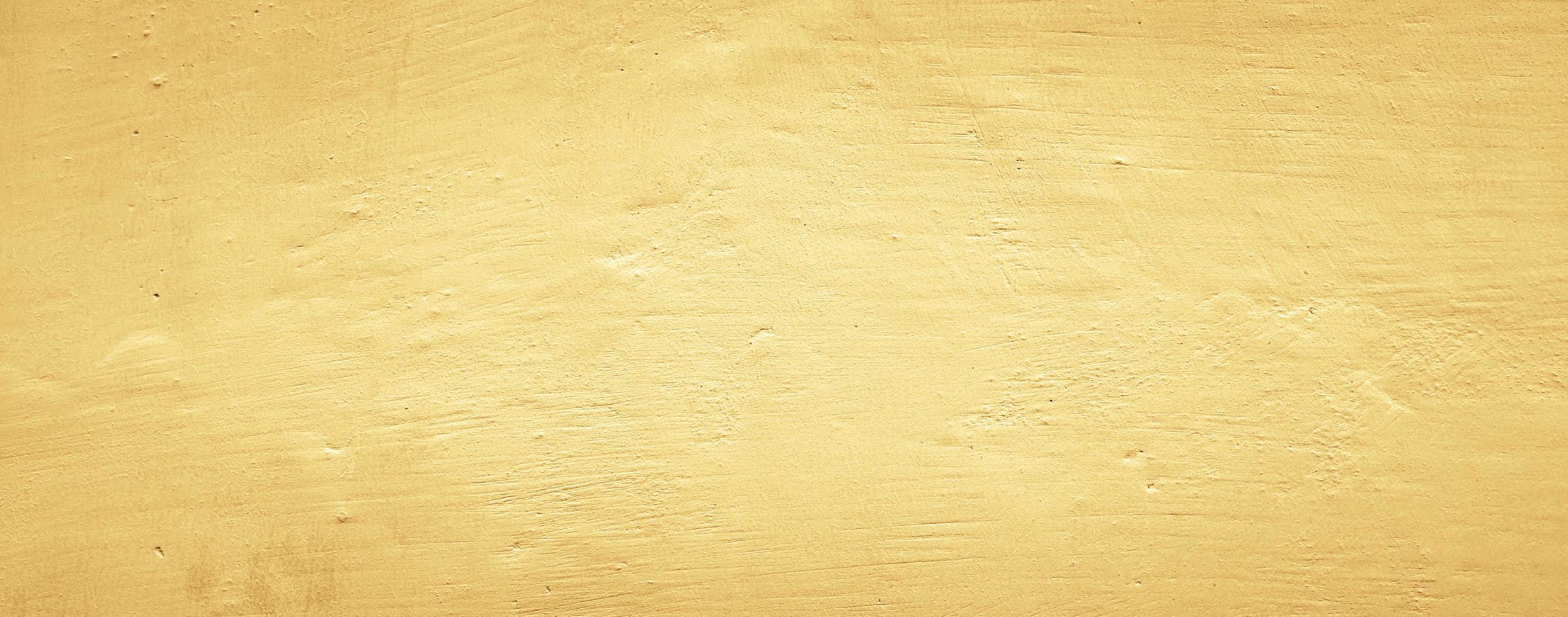 fundo de textura de parede de concreto amarelo abstrato, fundo panorâmico foto