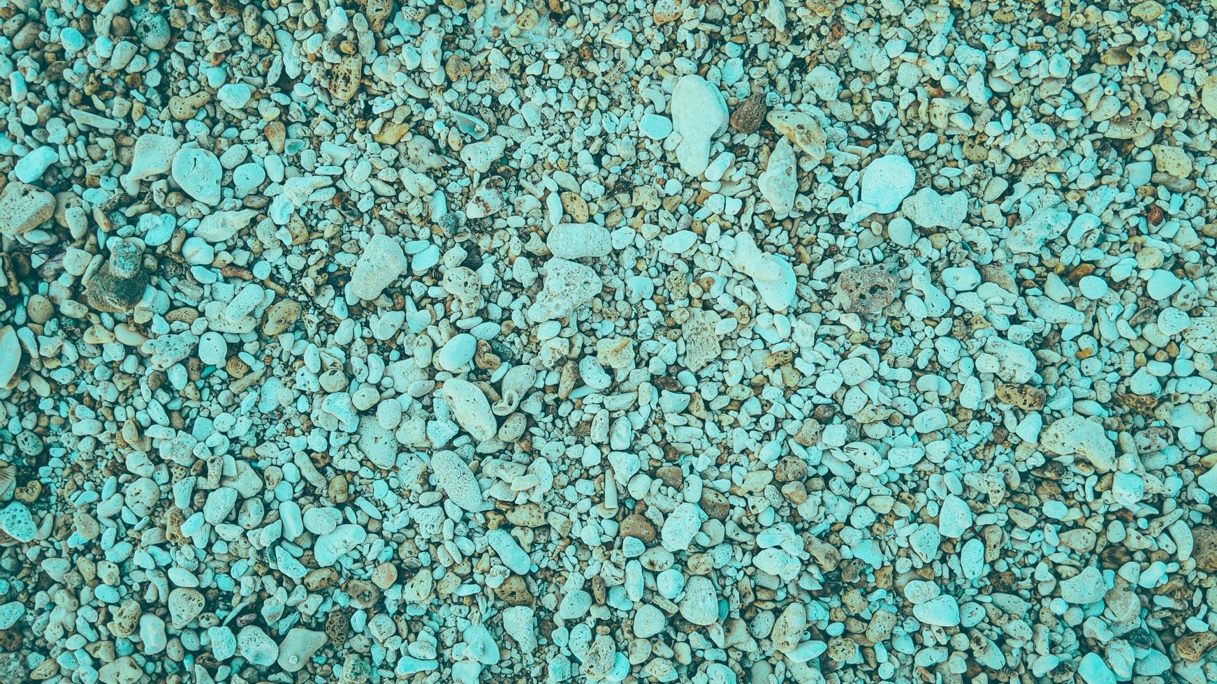 rocha seixos areia praia fundo de textura abstrata natural foto