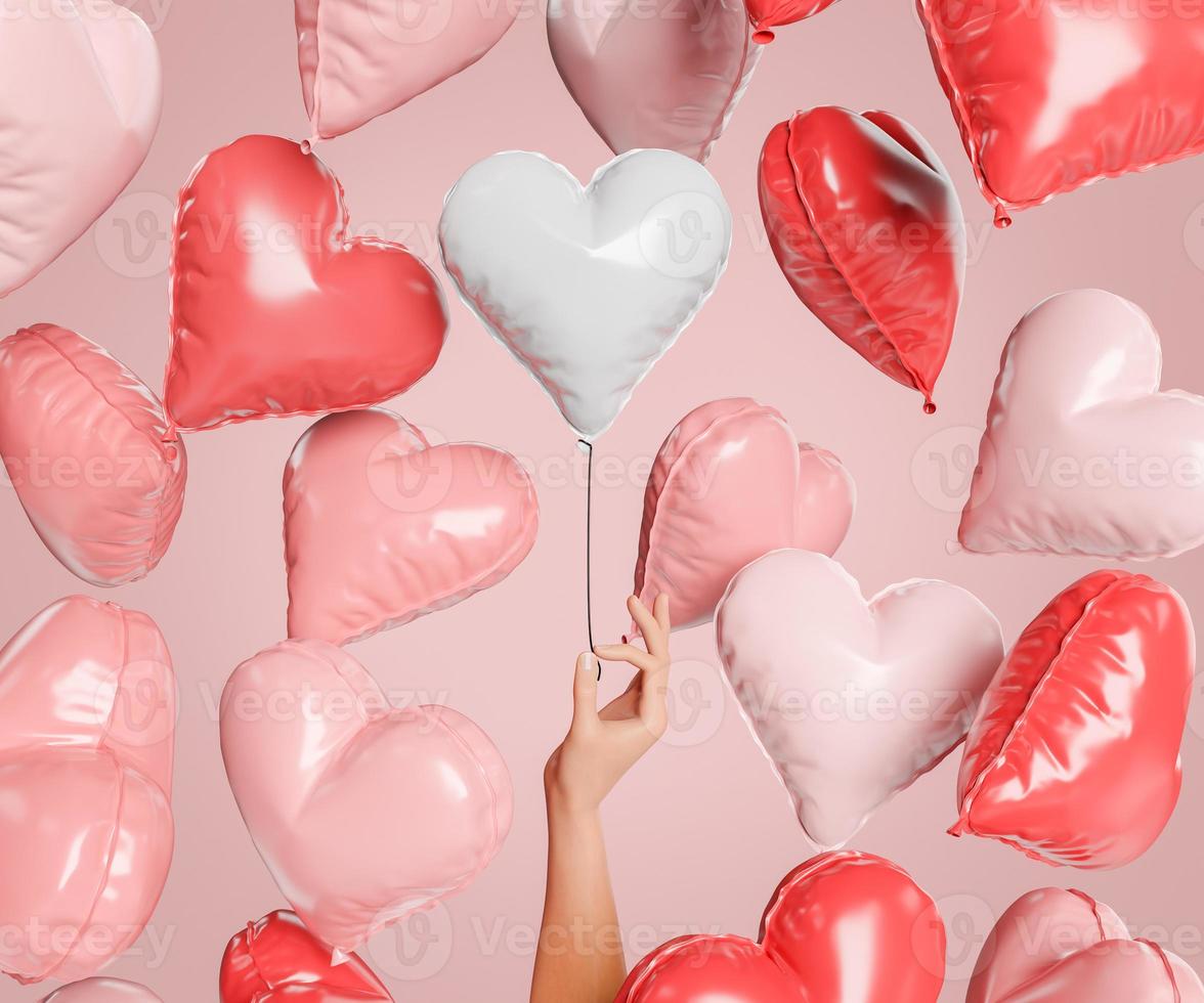 balões de coração flutuando com uma mão segurando um foto