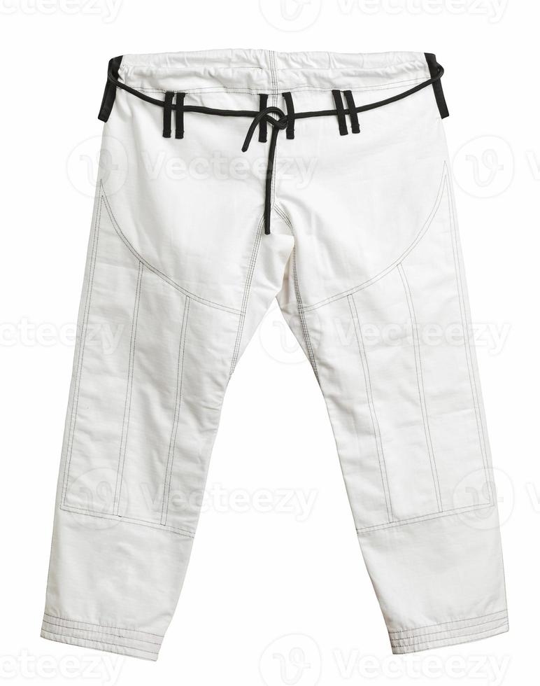 calças de um quimono esportivo para treinamento, isolado no fundo branco foto