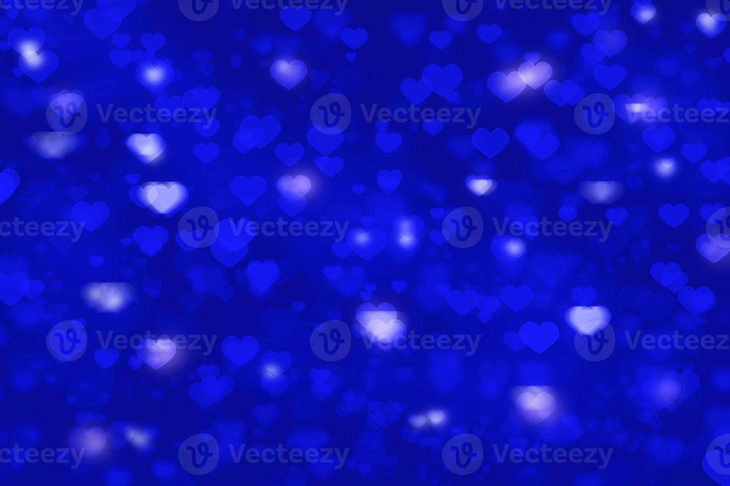 fundo azul bokeh em forma de coração para cartão de dia dos namorados ou papel de parede foto