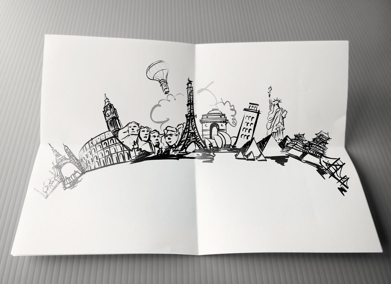 mão desenhada viajando ao redor do mundo em fundo de papel como conceito vintage foto