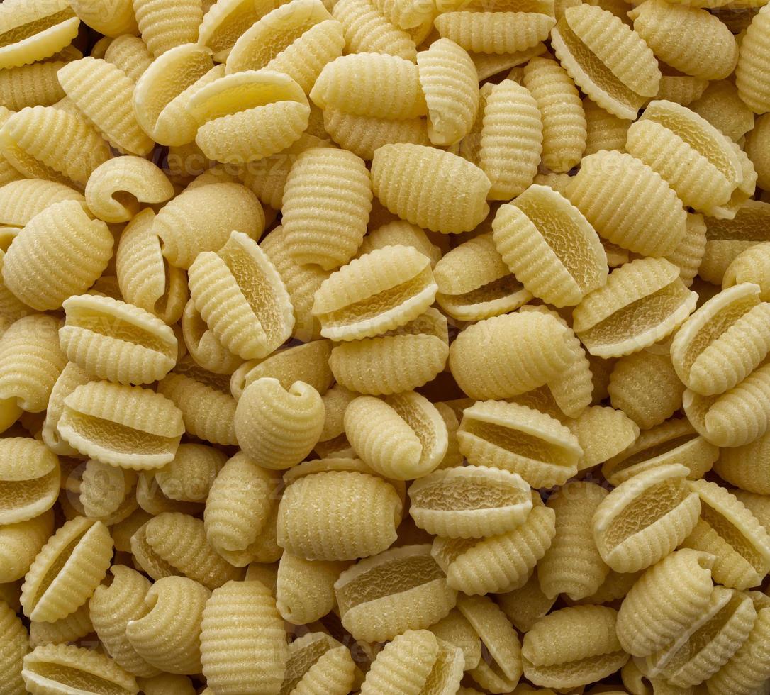 fundo de macarrão gnocchetti sardi italiano cru. fechar-se. foto