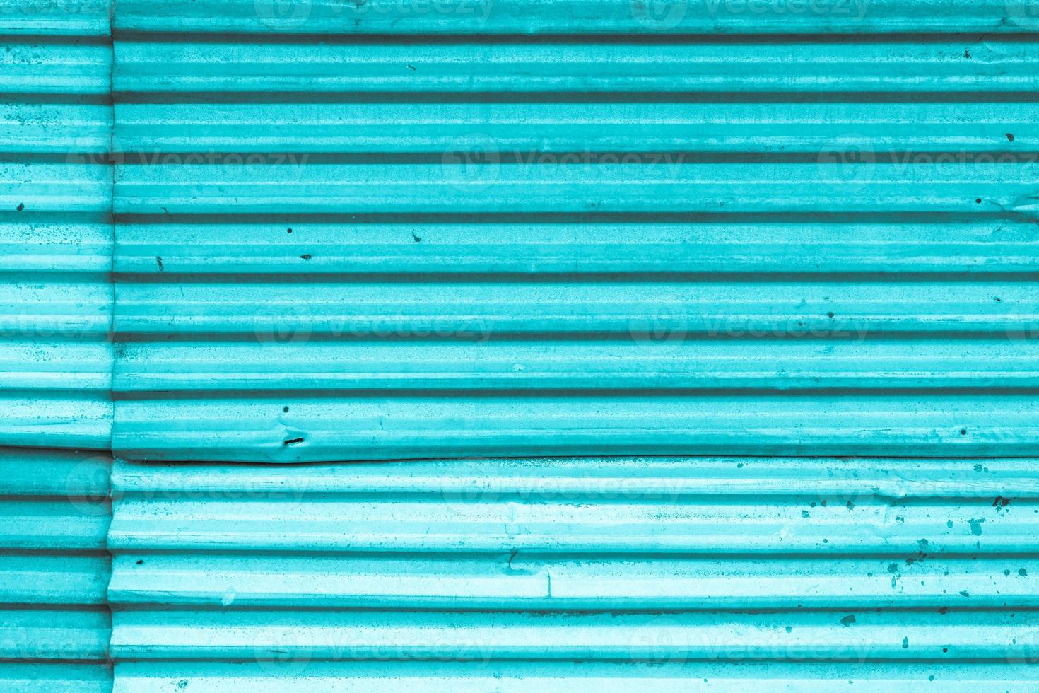 fundo de textura de cortina de ferro de frente de loja de metal de cor azul foto