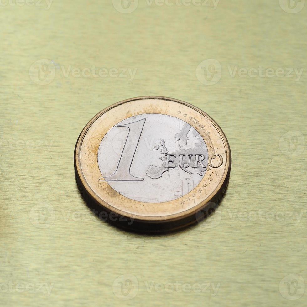 Moeda de 1 euro, união europeia sobre fundo dourado foto