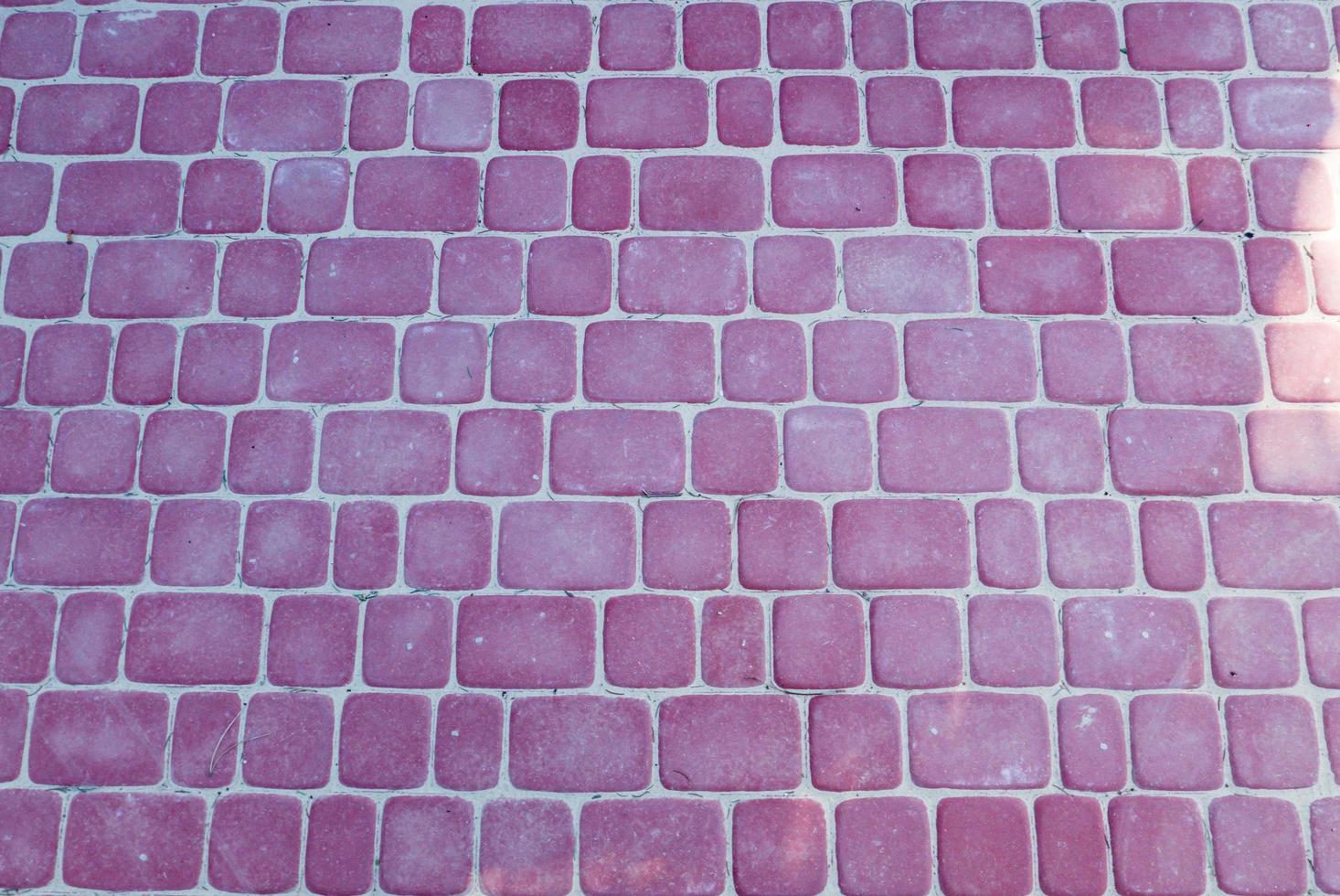 textura de tijolos rosa escuro. foto