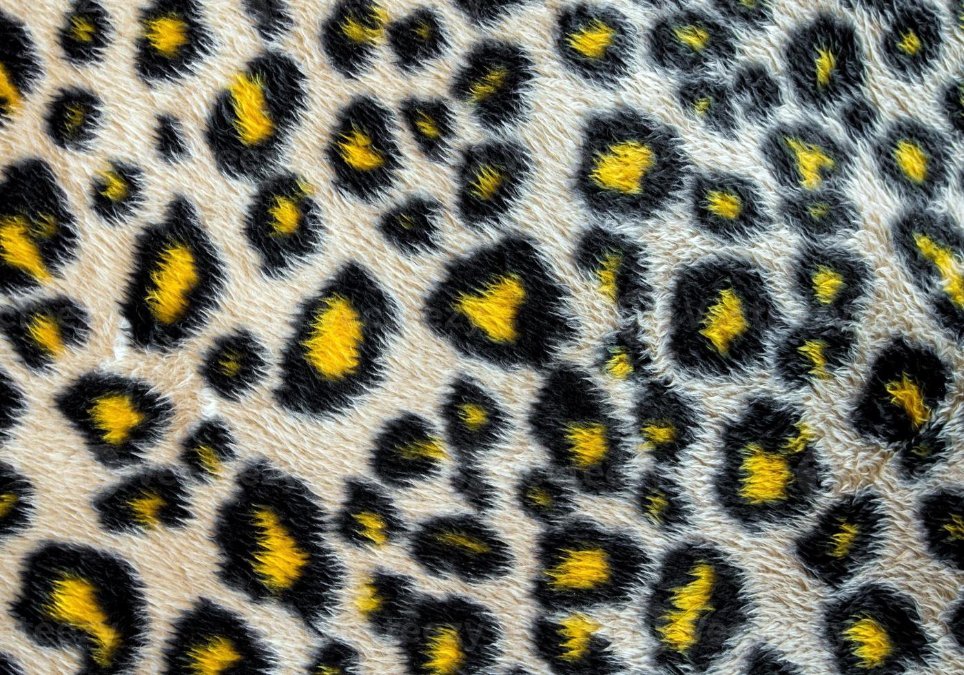 tecido de couro sintético com padrão de pele de leopardo foto