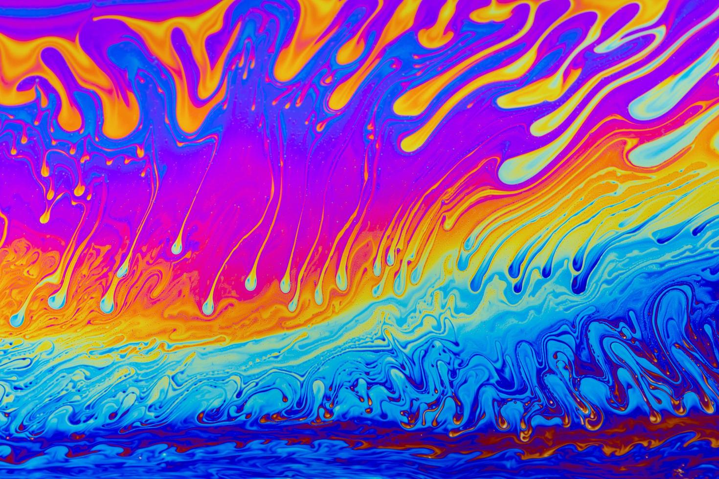 cores do arco-íris. fundo de padrões multicoloridos psicodélicos. foto macro de bolhas de sabão