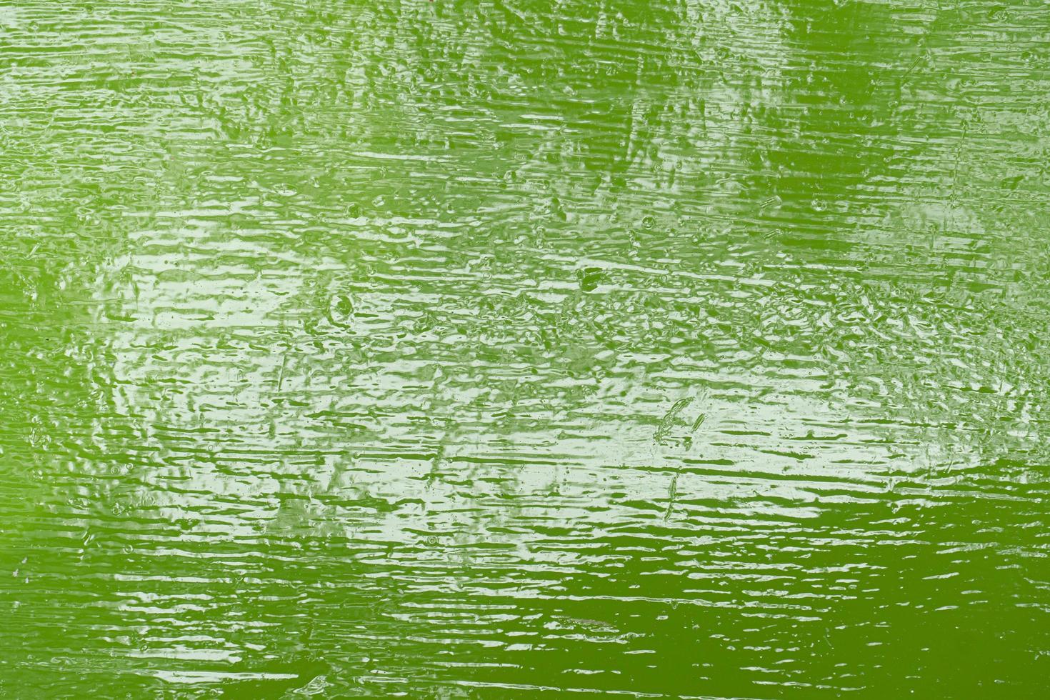 fundo e texturizado de tinta a óleo verde suave sobre fundo de aço. foto