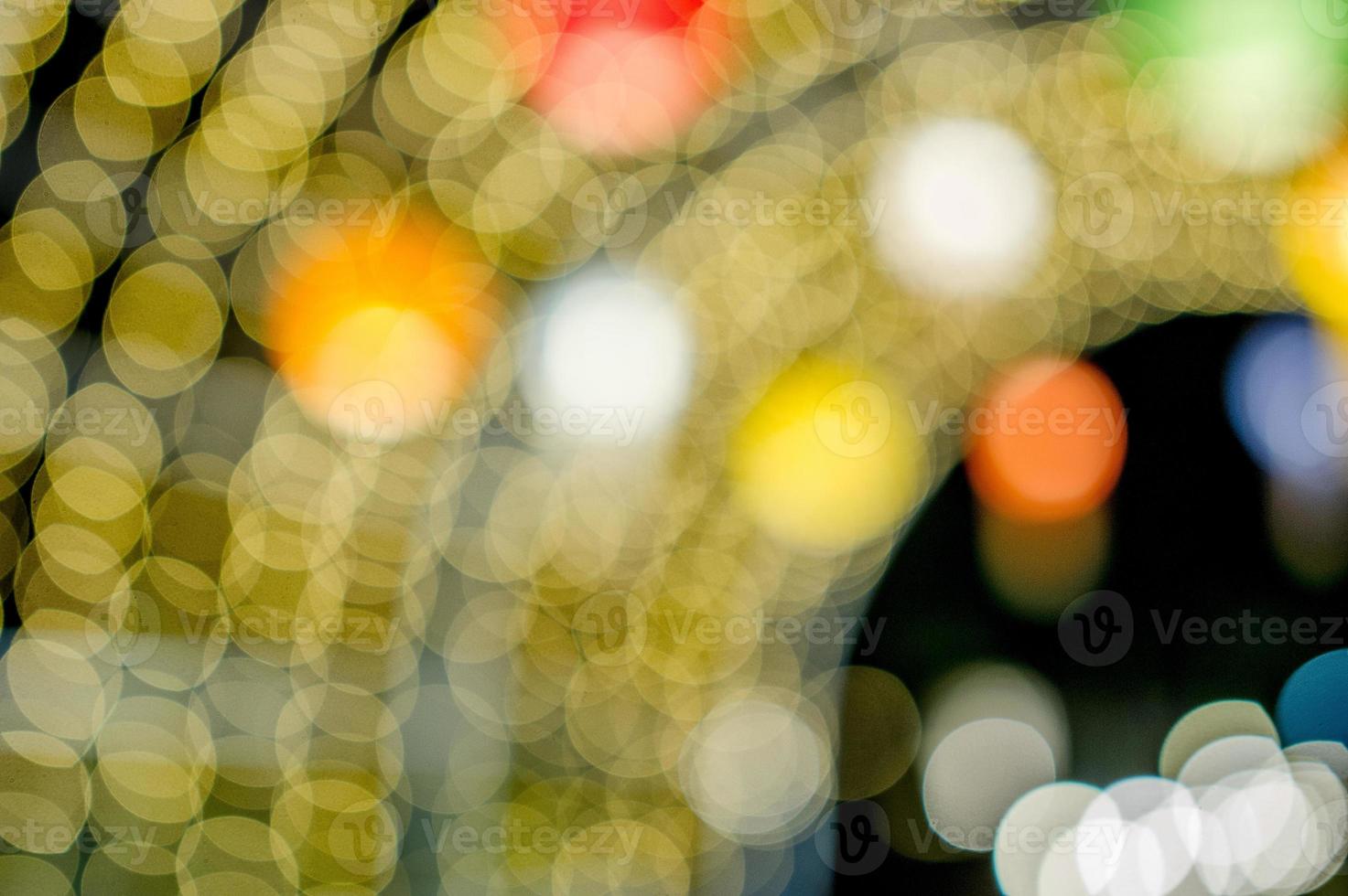 luzes coloridas no dia de ano novo, luzes do círculo bokeh, imagem de fundo com espaço de cópia. foto