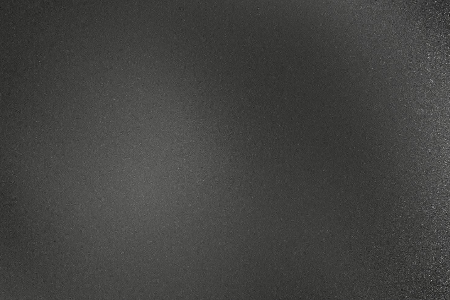 parede metálica preta áspera, fundo de textura abstrata foto