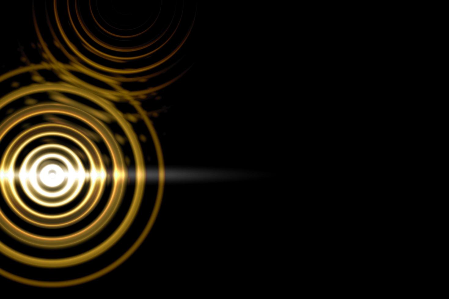 efeito abstrato círculo de luz com anéis de ouro em fundo preto foto
