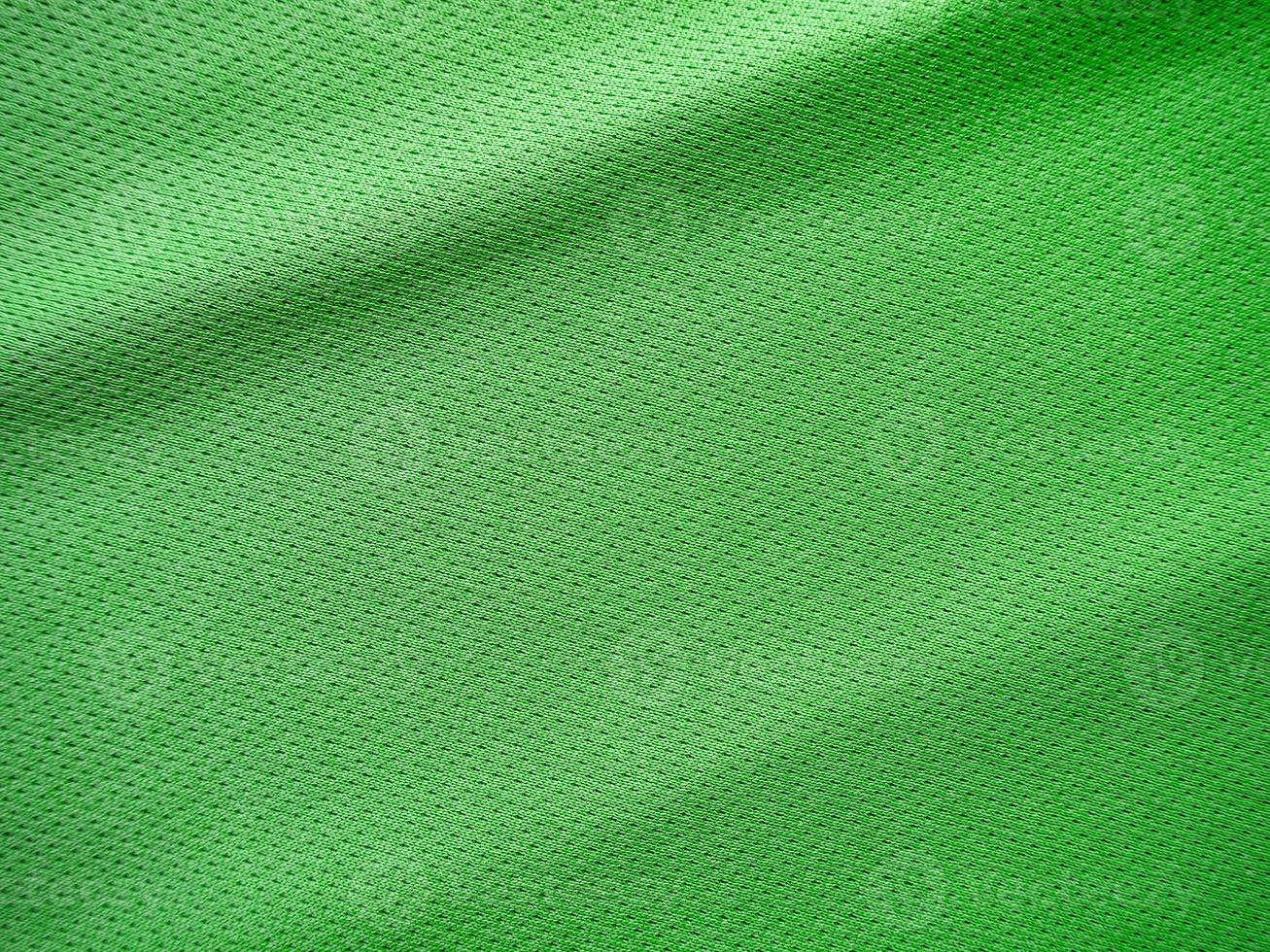 textura de jersey de tecido de roupas esportivas verdes foto