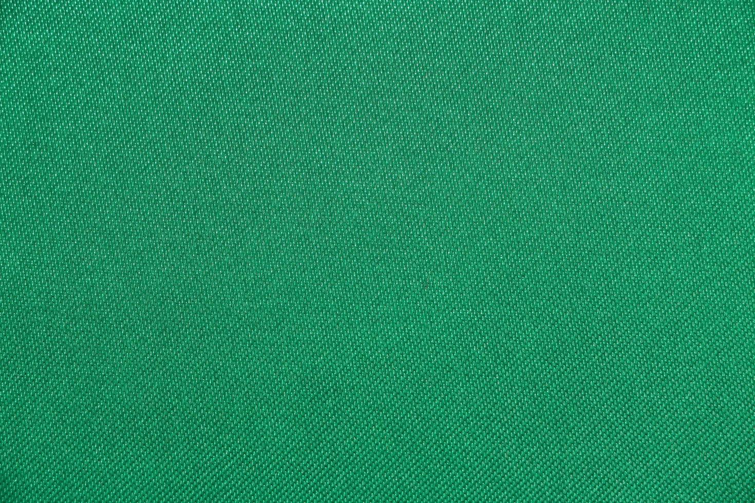 textura de tecido verde tem superfície lisa, fundo abstrato. foto