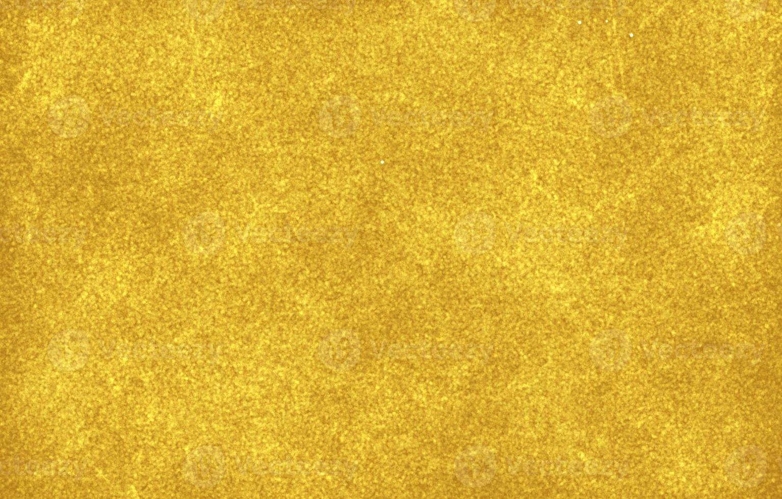 fundo de folha de ouro com reflexos de luz. parede texturizada dourada foto