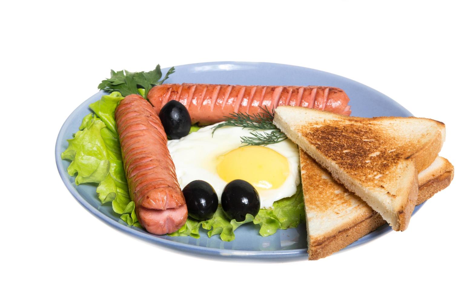 café da manhã com salsichas, torradas e ovo foto