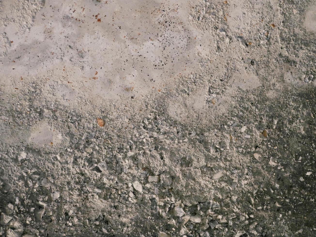 superfície de concreto rachado de cimento colorido, textura de áspero foto
