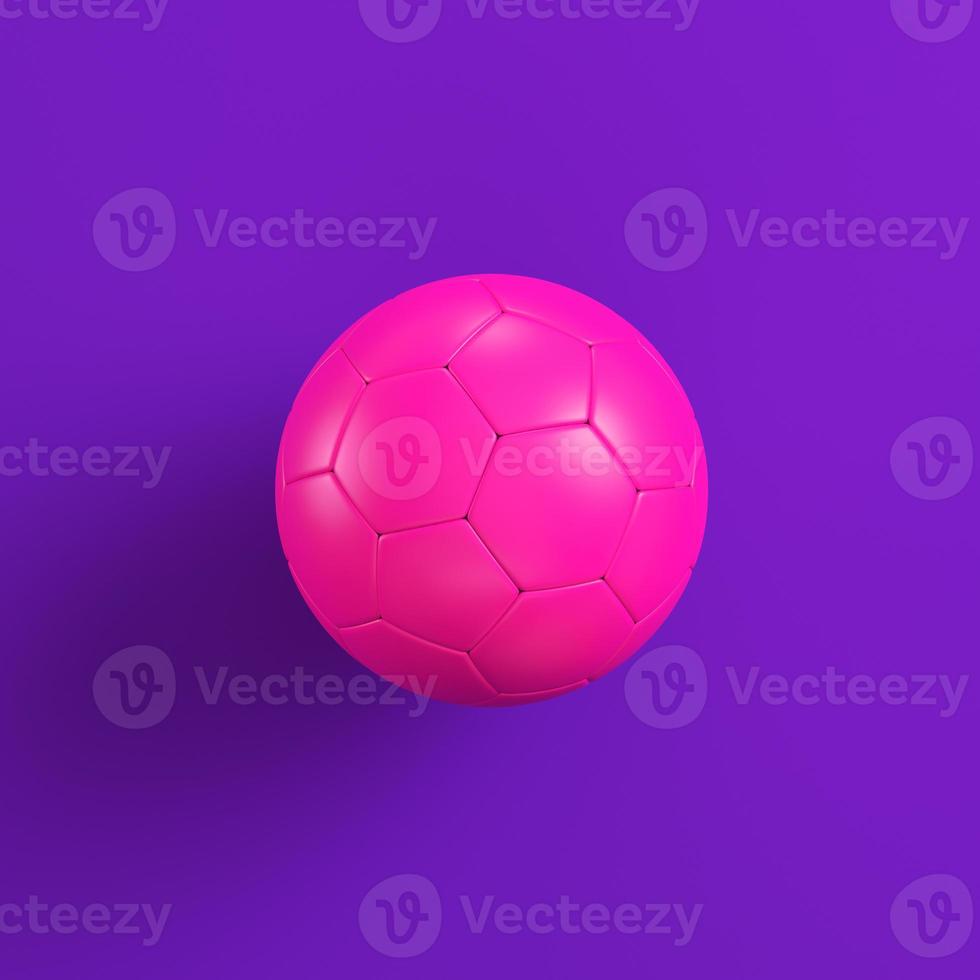 bola de futebol rosa sobre fundo roxo. conceito de minimalismo foto