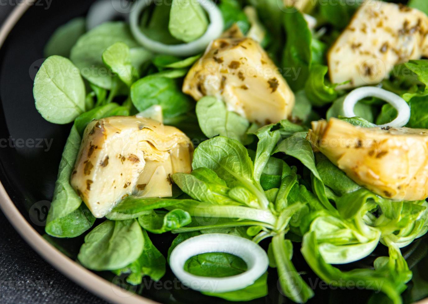 salada de alcachofra folhas verdes misturam comida fresca refeição saudável lanche dieta na mesa cópia espaço fundo de comida rústico foto