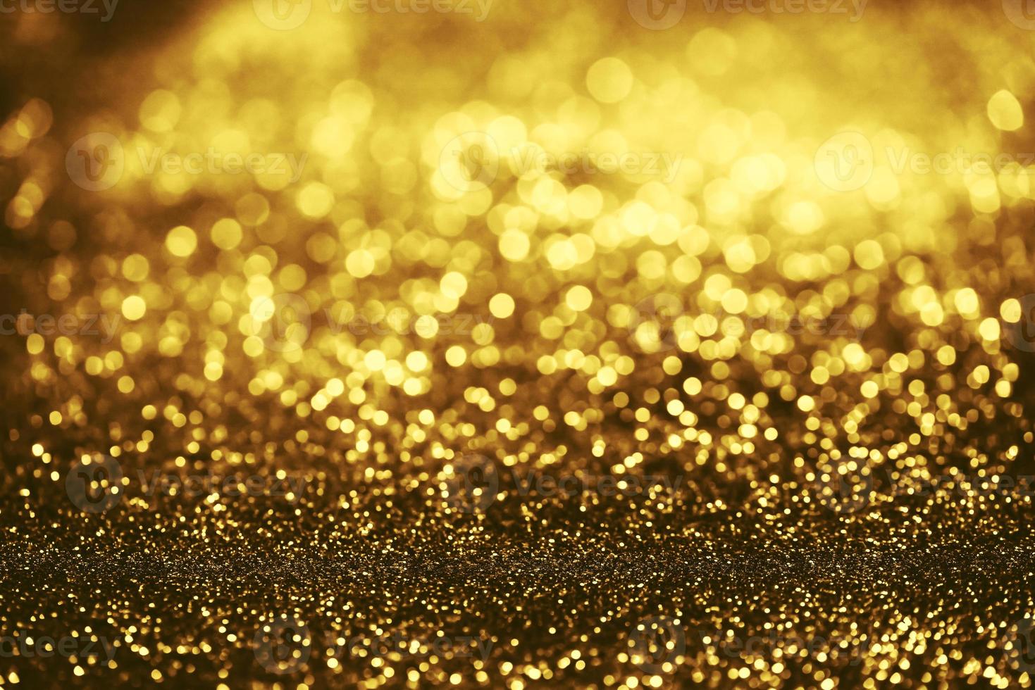 textura de iluminação de bokeh de brilho dourado turva fundo abstrato para aniversário, aniversário, casamento, véspera de ano novo ou natal foto