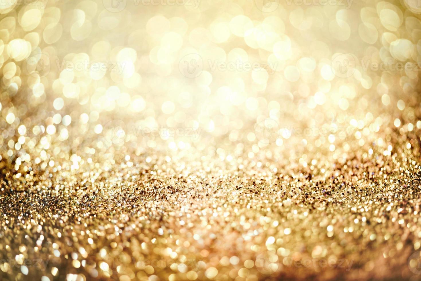 textura de iluminação de bokeh de brilho dourado turva fundo abstrato para aniversário, aniversário, casamento, véspera de ano novo ou natal foto