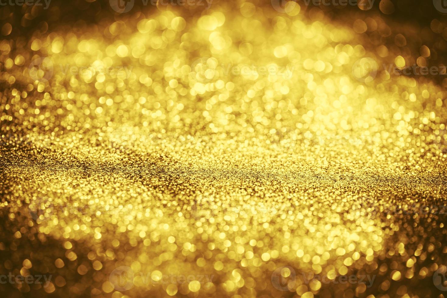 textura de iluminação de bokeh de brilho dourado turva fundo abstrato para aniversário, aniversário, casamento, véspera de ano novo ou natal foto