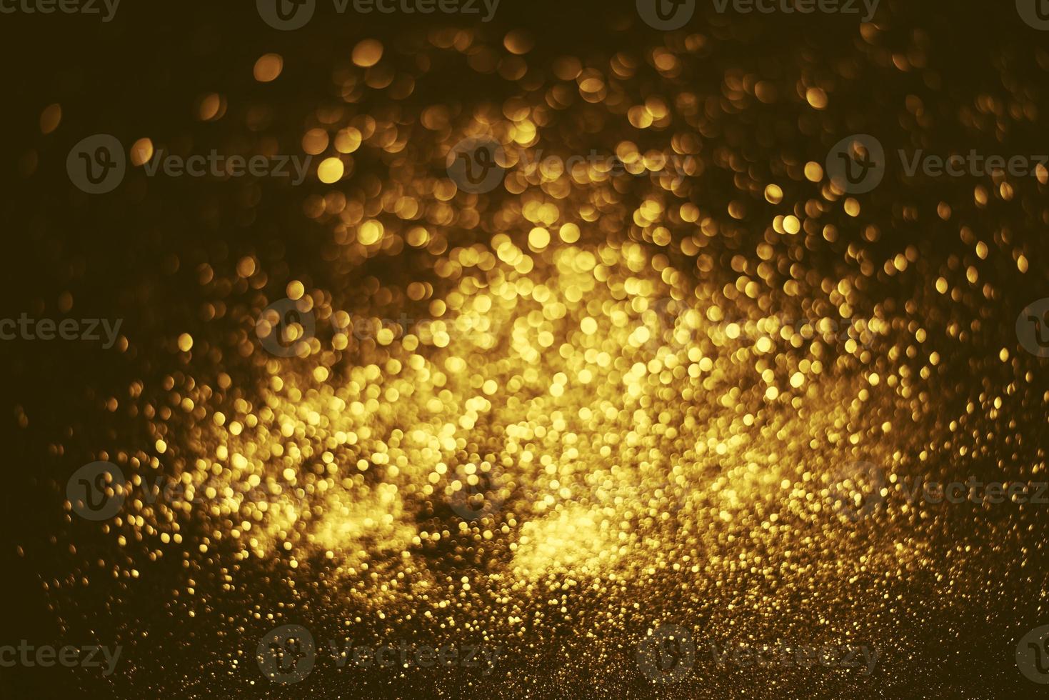 textura de iluminação de bokeh de brilho dourado turva fundo abstrato para aniversário, aniversário, casamento, véspera de ano novo ou natal foto